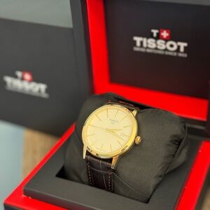 Tissot Elegant Gold Watch with Dark Brown Strap